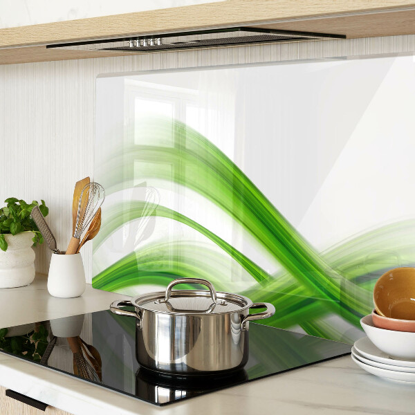 Glas-Schneidebrett mit grünem abstraktem Wellenmotiv
