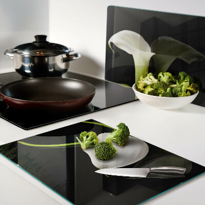 Schneidebrett Glas mit Lilienmotiv auf schwarzem Hintergrund