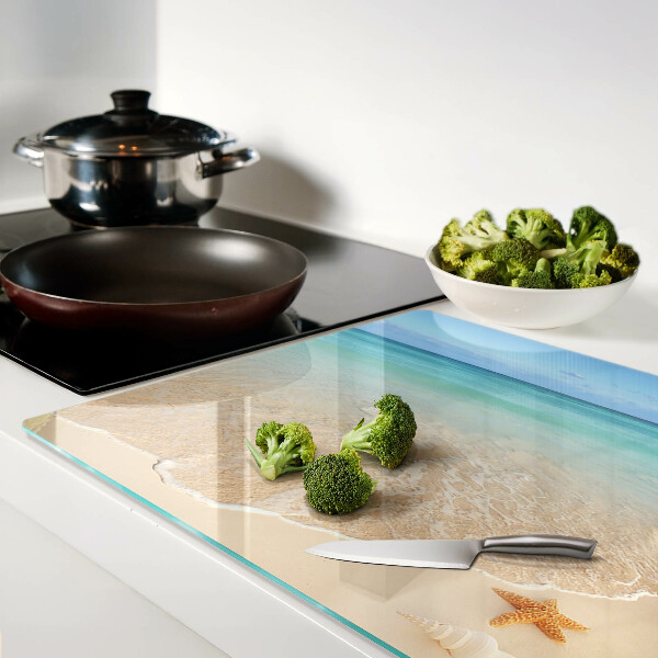 Schneidebrett mit Strandmotiv mit Muscheln und Wellen