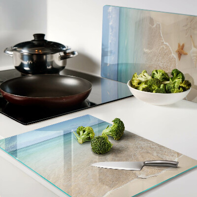 Schneidebrett mit Strandmotiv mit Muscheln und Wellen