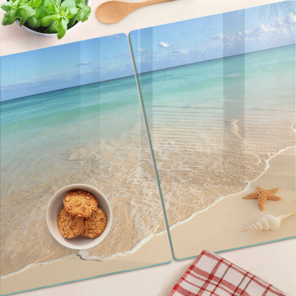 Schneidebrett mit Strandmotiv mit Muscheln und Wellen