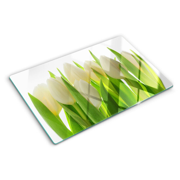 Schneidebrett glas Tulpen vor dem Hintergrund grüner Blätter