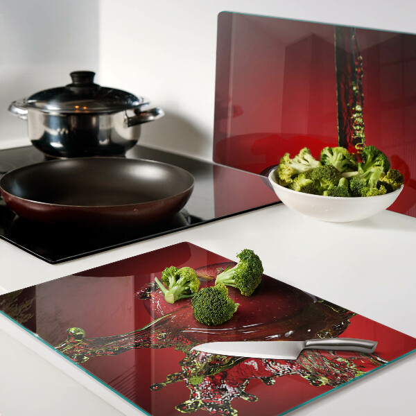 Glas-Schneidebrett mit Motiv roter Apfel und Wasserspritzern