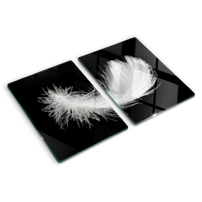 Schneidebrett Glas mit Motiv einer Feder auf schwarzem Hintergrund