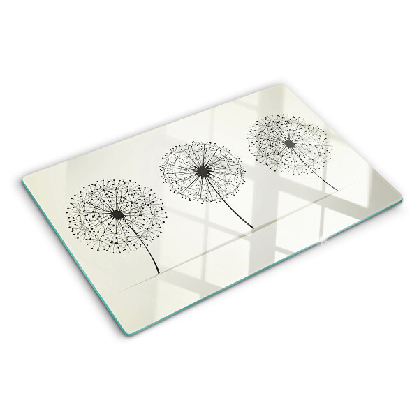 Schneidebrett mit Löwenzahn-Motiv auf weißem Hintergrund