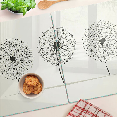 Schneidebrett mit Löwenzahn-Motiv auf weißem Hintergrund