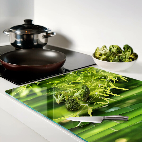 Schneidebrett Glas mit Motiv aus Bambusblättern und grünem Laub