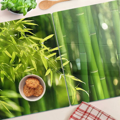 Schneidebrett Glas mit Motiv aus Bambusblättern und grünem Laub