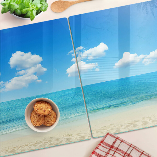 Schneidebrett mit Strandmotiv und blauem Himmel