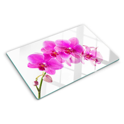 Glas-Schneidebrett mit Orchideen in Rosatönen