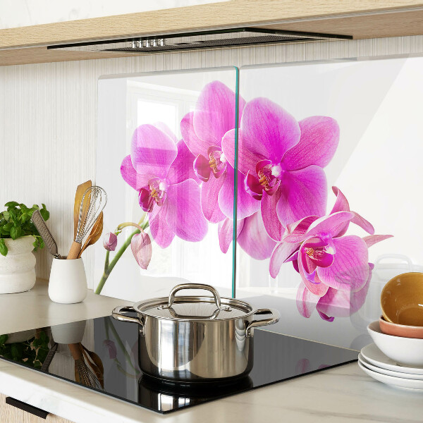Glas-Schneidebrett mit Orchideen in Rosatönen