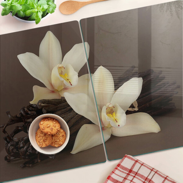Glas schneidebrett Orchideen und Vanilleschoten