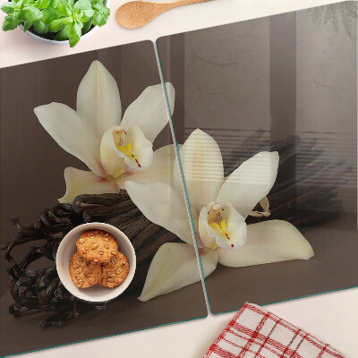 Glas schneidebrett Orchideen und Vanilleschoten