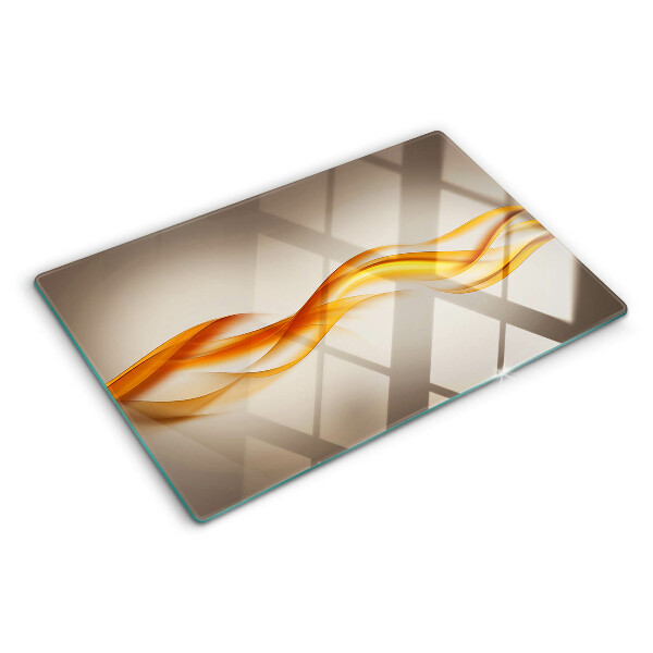 Schneidebrett Glas mit wellenförmigem Muster in Goldtönen