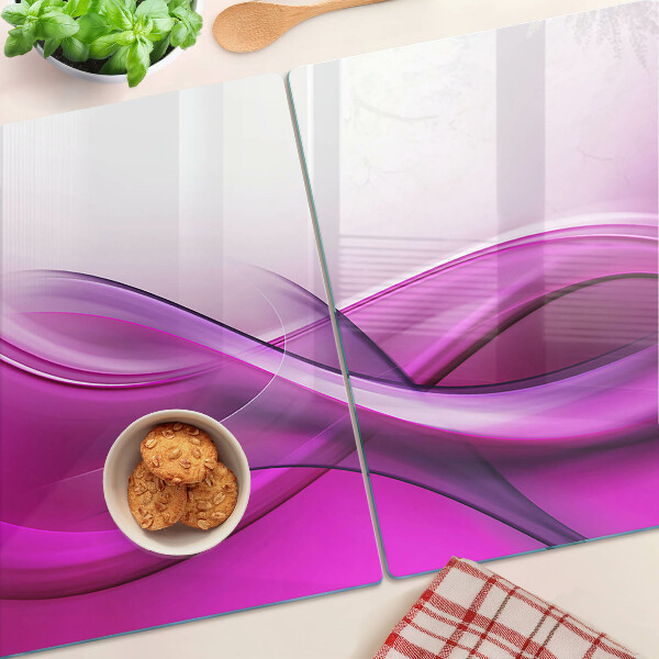 Glas-Schneidebrett mit Wellenmotiv in Rosatönen