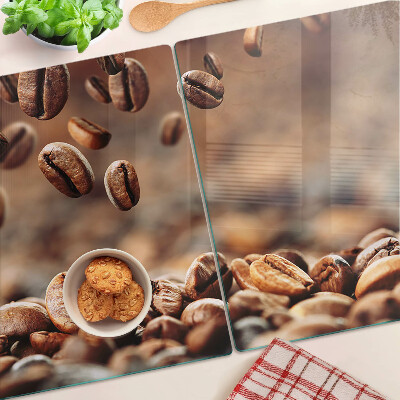 Schneidebrett mit Motiv „Kaffeebohnen in Bewegung”