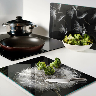 Schneidebrett Glas mit Löwenzahnmotiv auf schwarzem Hintergrund