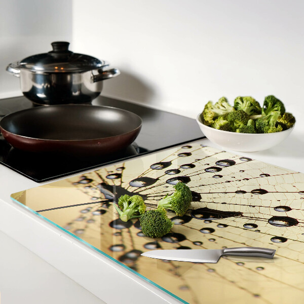 Schneidebrett mit Motiv von Wassertropfen auf einem Spinnennetz