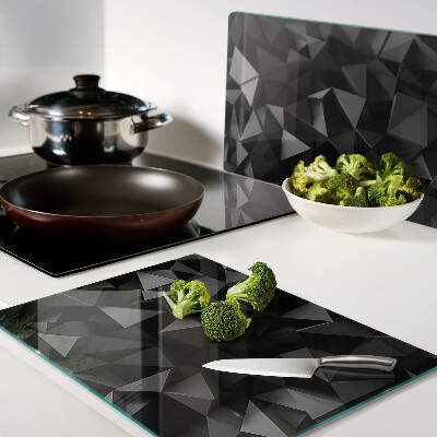 Glas-Schneidebrett mit geometrischem Polygonmotiv in Schwarztönen