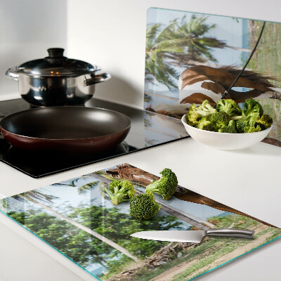 Schneidebrett glas Ein Pferd vor Palmen im Hintergrund