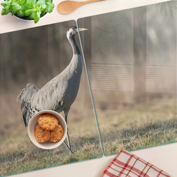 Schneidebrett glas Ein Kran vor der Kulisse einer Landschaft