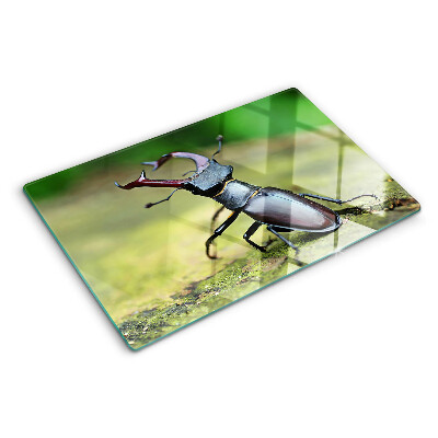Schneidebrett Glas mit Hirschkäfer-Motiv auf grünem Hintergrund