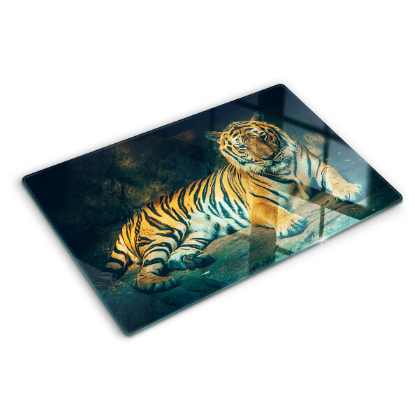 Glas-Schneidebrett mit Motiv eines liegenden Tigers auf Felsen