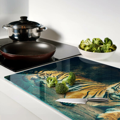 Glas-Schneidebrett mit Motiv eines liegenden Tigers auf Felsen