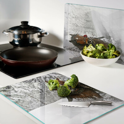 Glas schneidebrett Kaltblüter im Schnee