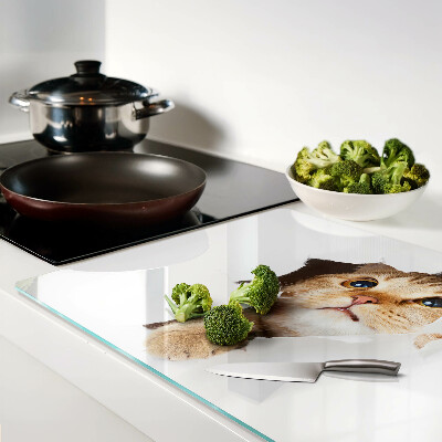 Schneidebrett Eine Katze, die durch ein Loch in der Wand schaut.