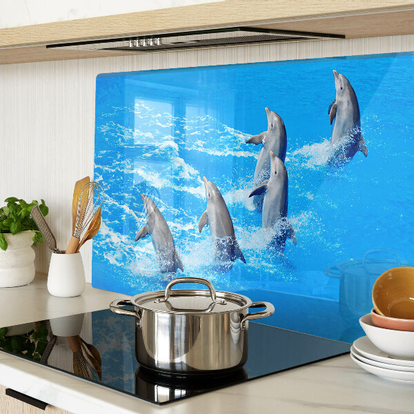 Schneidebrett Glas mit Motiv von Delfinen, die über Wellen springen