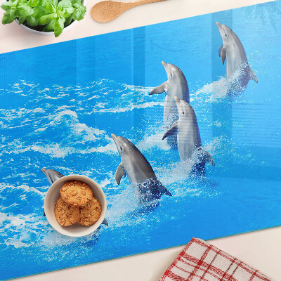 Schneidebrett Glas mit Motiv von Delfinen, die über Wellen springen