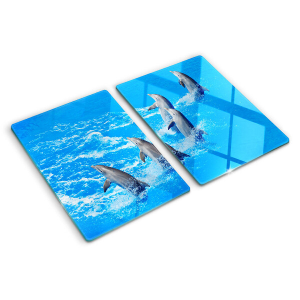 Schneidebrett Glas mit Motiv von Delfinen, die über Wellen springen