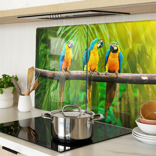 Schneidebrett mit Motiv Papageien auf einem Ast in tropischer Umgebung