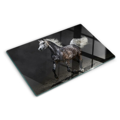 Glas schneidebrett Ein geflecktes Pferd auf der Flucht
