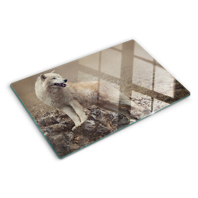 Schneidebrett mit Motiv eines Wolfes auf einem felsigen Berg