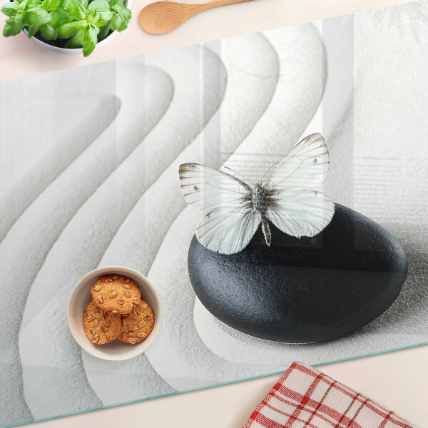 Schneidebrett Glas mit Schmetterlingsmotiv auf Steinhintergrund