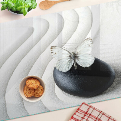 Schneidebrett Glas mit Schmetterlingsmotiv auf Steinhintergrund