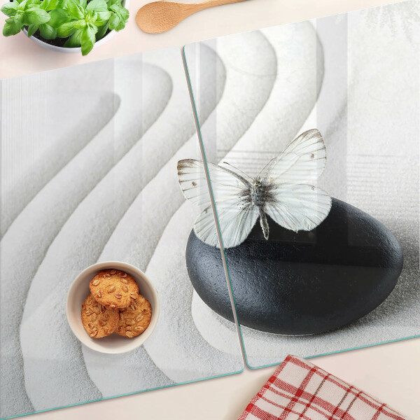 Schneidebrett Glas mit Schmetterlingsmotiv auf Steinhintergrund