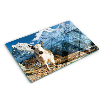 Schneidebrett mit Motiv einer Kuh in den Bergen