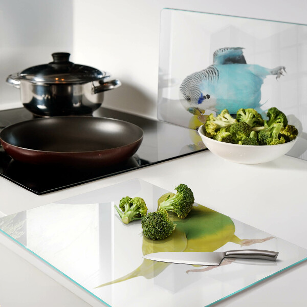 Schneidebrett Glas mit gelbem und blauem Papageienmotiv