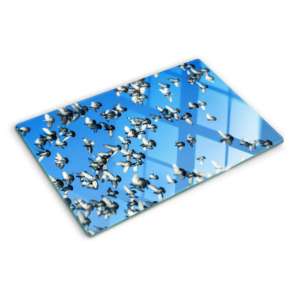 Schneidebrett glas Tauben, die am Himmel fliegen