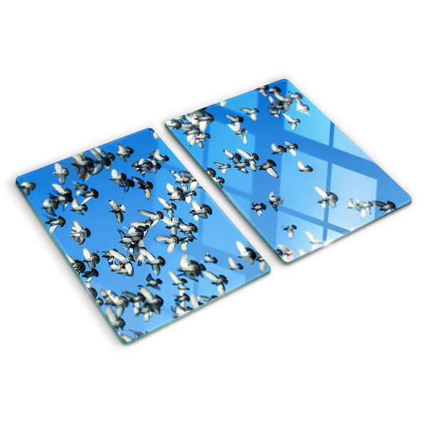 Schneidebrett Glas mit Motiv von Tauben, die am Himmel fliegen