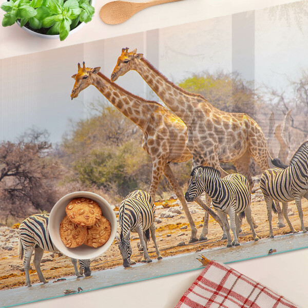 Glas-Schneidebrett mit Motiv von Zebras und Giraffen in ihrem natürlichen Lebensraum