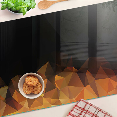 Glas-Schneidebrett mit einem Motiv brennendes Lagerfeuer im geometrischen Stil