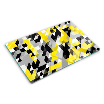 Glas-Schneidebrett mit geometrischem Muster in Gelb- und Schwarztönen