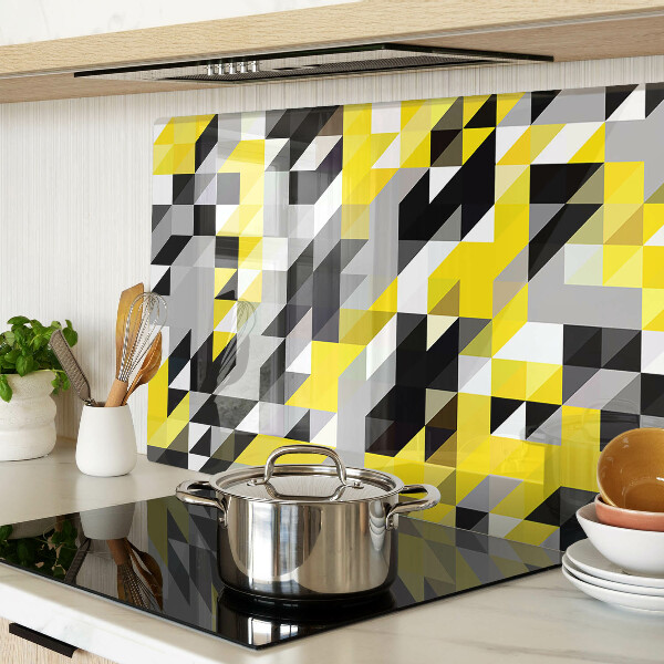 Glas-Schneidebrett mit geometrischem Muster in Gelb- und Schwarztönen