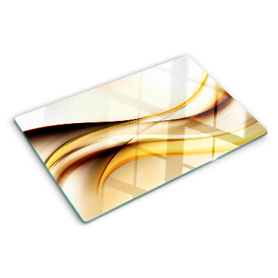 Schneidebrett Glas mit abstraktem Wellenmotiv in Goldtönen