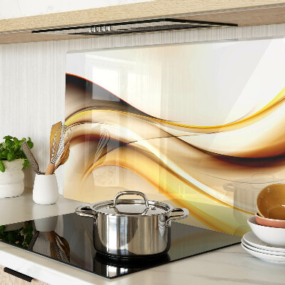 Schneidebrett Glas mit abstraktem Wellenmotiv in Goldtönen