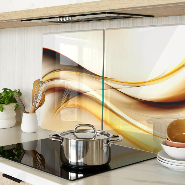 Schneidebrett Glas mit abstraktem Wellenmotiv in Goldtönen